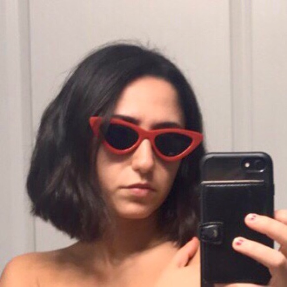 Red cat eye sunglasses with black lens. Never worn